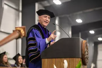 AU President Carlos Campo speaking at 2024 commencement